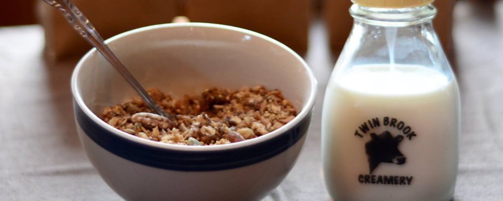 bowl of granola and bottle of milk