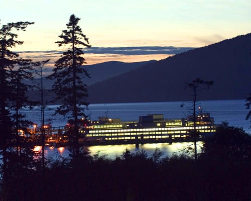 Ferry crossing the water at dusk