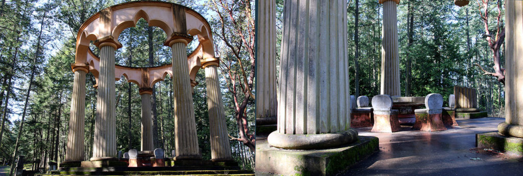 Monument with large columns in a forested area