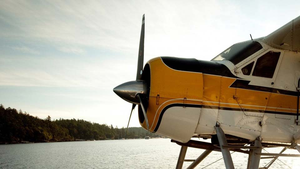 float plane in profile docked in the water