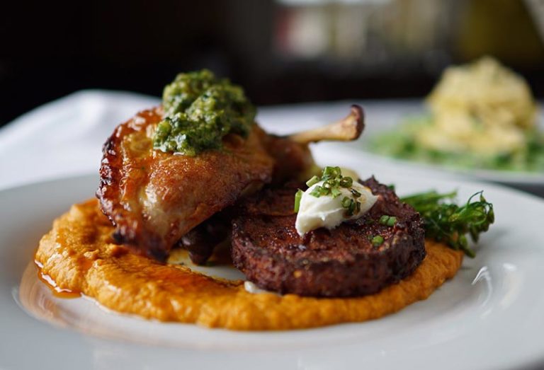 plate of lamb chops on a puree