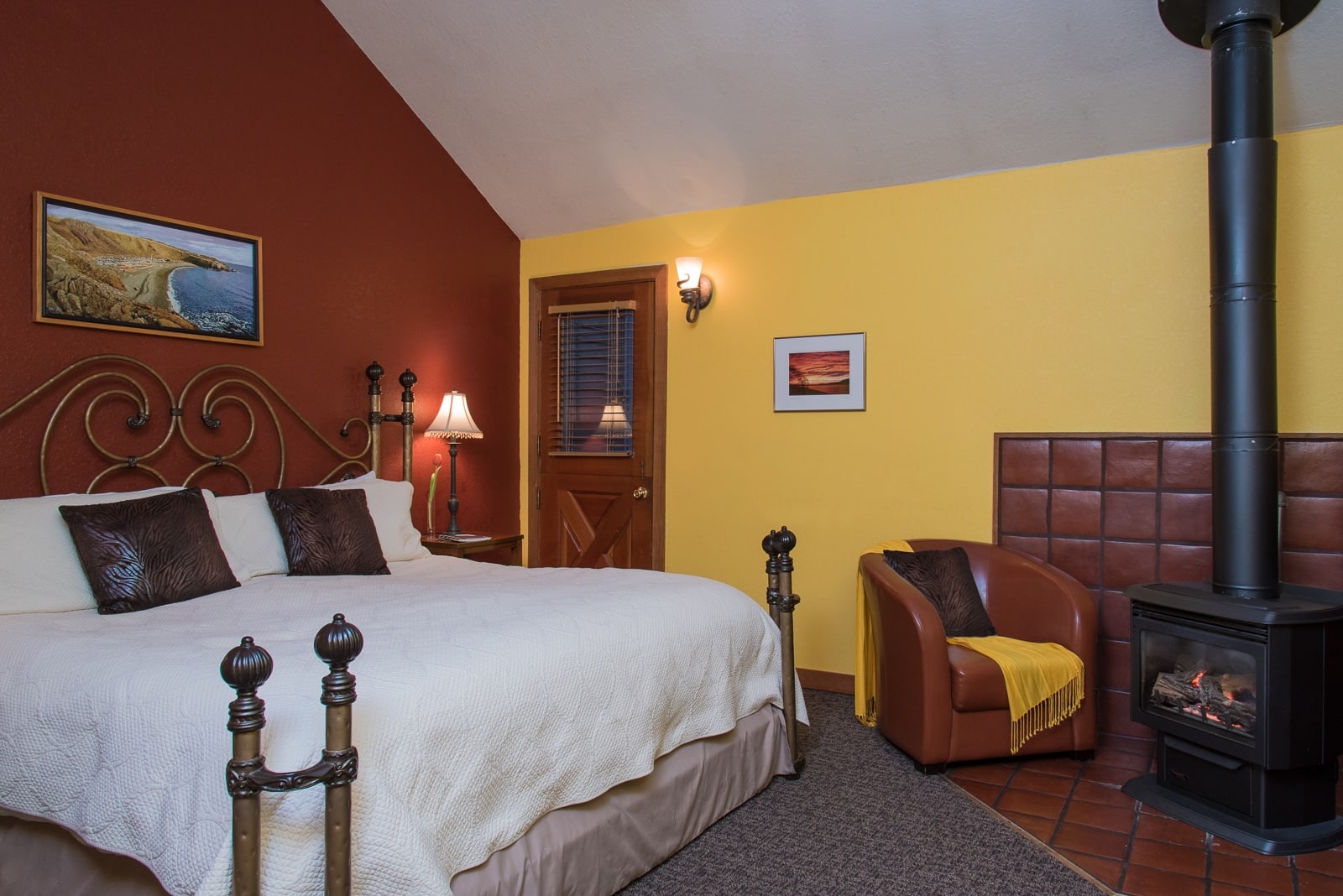 Stay at the best Friday Harbor Lodging and enjoy a room with a fireplace, seating area, and queen sized bed. 