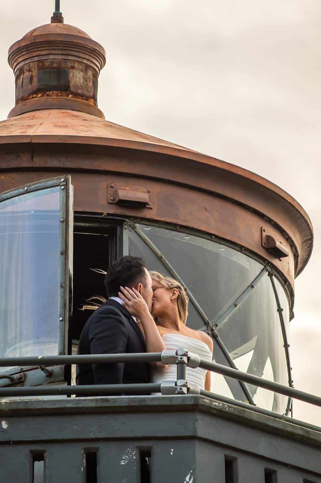 Couple at Lime Kiln Lighthouse during one of our elopement packages in Washington State