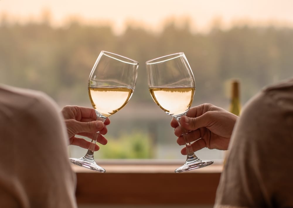 Couple enjoying a wine tasting, one of the most romantic things to do in Friday Harbor this winter