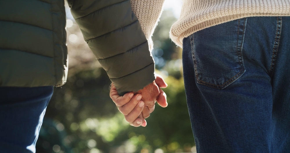 couple holding hands during their romantic anniversary Getaways on San Juan Island